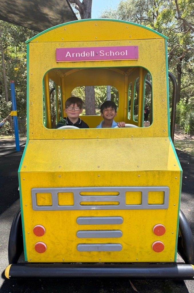 The school bus with children playing